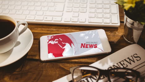 animation of a smartphone showing a globe and words breaking news on the screen