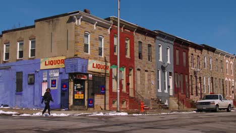 a liquor store on a corner of a north baltimore slum