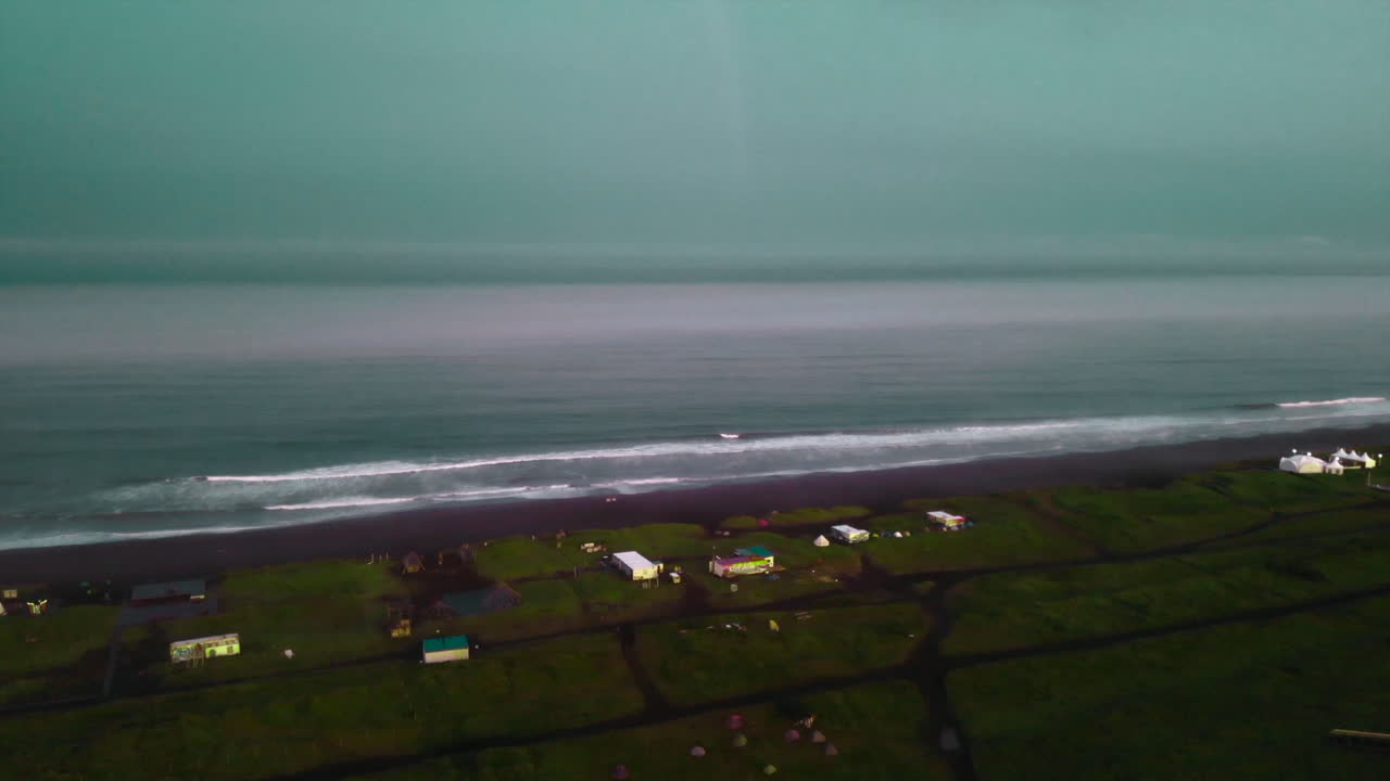 Aerial view of a coastline with houses