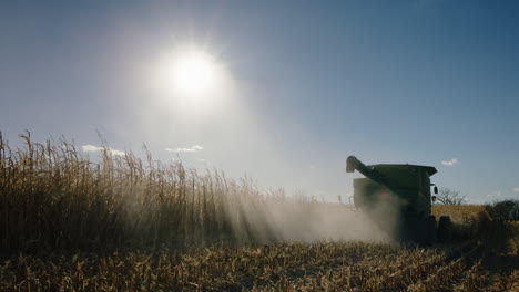 combine harvester, sunny day, slow motion