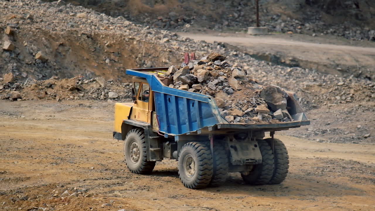 Big mining dumping truck. Mining truck in quarry road