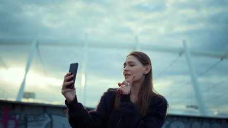 girl recording video on smartphone