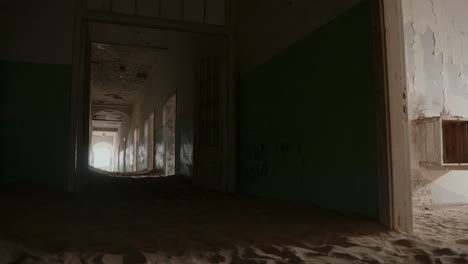 abandoned hospital corridor filled with sand