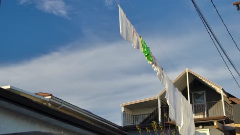 A-View-Of-Drying-Clothes-On-a-Clothesline-In-A-Quiet-Village