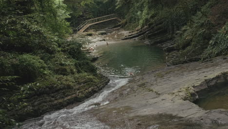 hidden waterfall pool with people