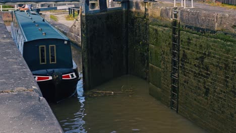 Canal-leisure-Narrowboat-barge-navigating-through-set-of-locks-on-Shropshire-Union-canal