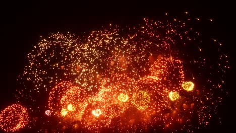 firework display at night on black background.