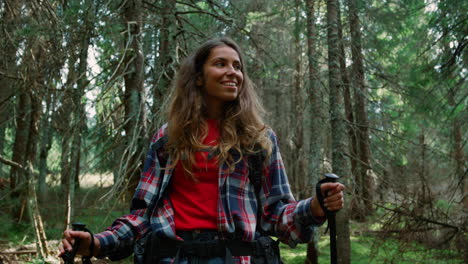 active woman hiking in forest. female tourist walking in woods