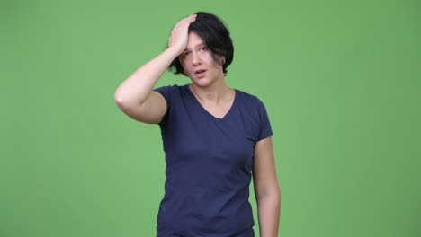 stressed woman with short hair getting bad news