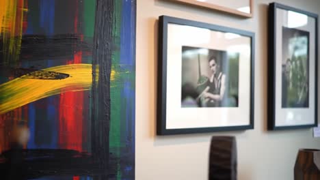 artistic fusion: a vibrant exploration of paintings and photographs enriching an interior space with colorful accents and elegant decor