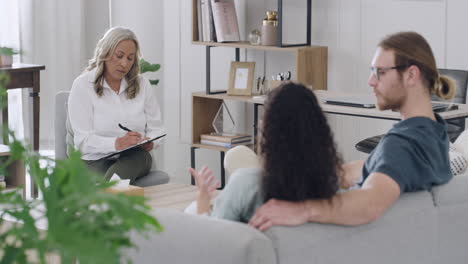 psychologist listening to a young couple