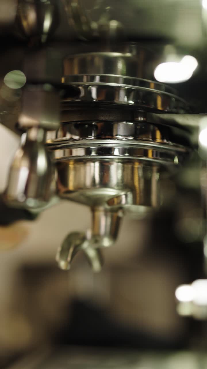 Espresso Machine Brewing Coffee into Green Cup