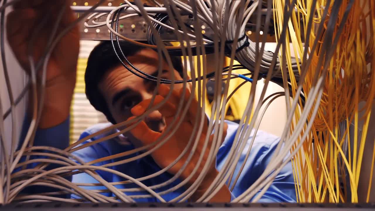 Technician fixing cable
