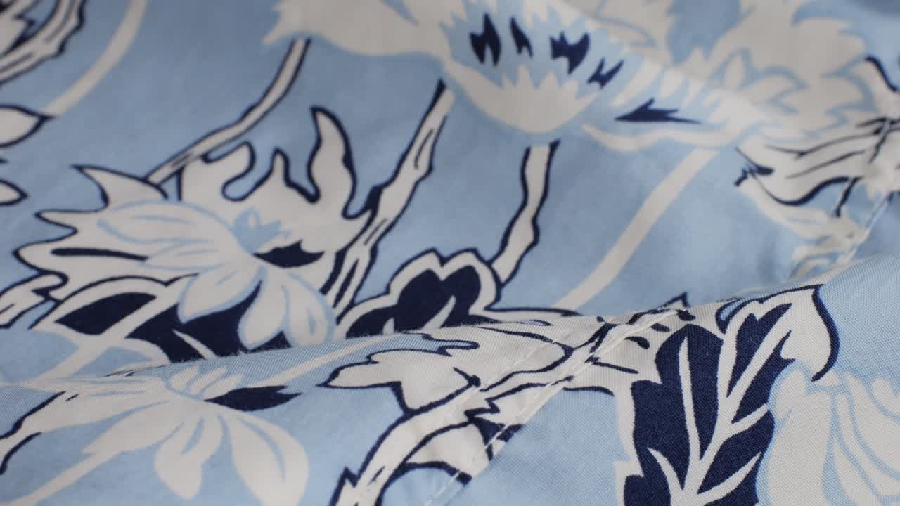 Colorful textile cloth texture close-up macro. Floral print. Fashion fabric multicolor.