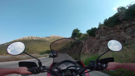 riding a motorcycle on penteli mountain in greece