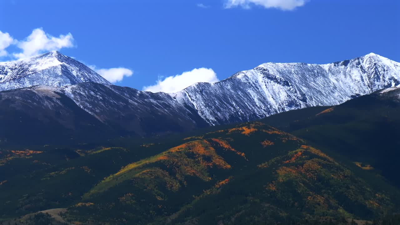 Mt Mount Shavano 14er Tabeguache Peak aerial drone parallax right Colorado trail Sawatch Range fall autumn aspen trees San Isabel National Forest snow dusting morning vibrant blue sky clouds