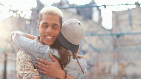 close-up view of hipster happy couple hugging in the street