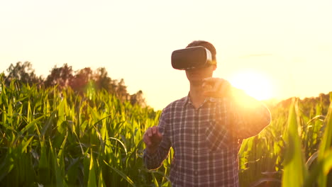 Smart-farming-with-IoT-futuristic-agriculture-concept-:-Farmer-wears-VR-or-AR-glasses-while-monitoring-rainfall-temeprature-humidity-soil-pH-with-immersive-experience-on-digital-holographic-screen.