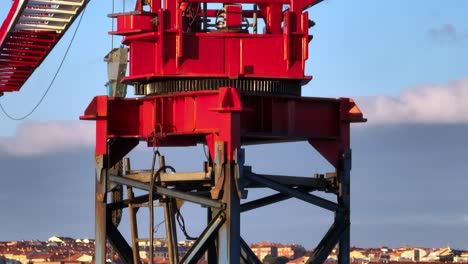 Close-up-detail-view-of-a-rusty-construction-crane,-aerial-view