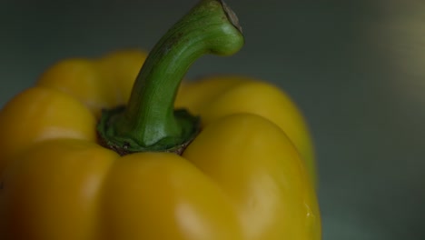 selective focus of yellow bell pepper skin gets blacked with the heat effect, vegetables on hot oven cooking concept in extreme close up 4k shot