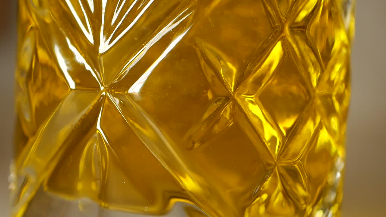 Close-up of Olive Oil in a Decorative Glass Jar