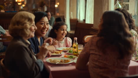 joyful multi-generational family dining at a restaurant