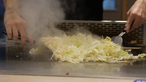 preparing teppanyaki cabbage