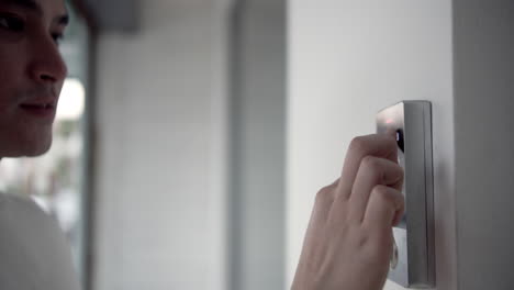 a user interacts with a smart control panel in a modern office setting showcasing the ease of digital interactions.