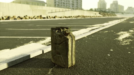 old fuel canister on an abandoned road in a deserted urban area