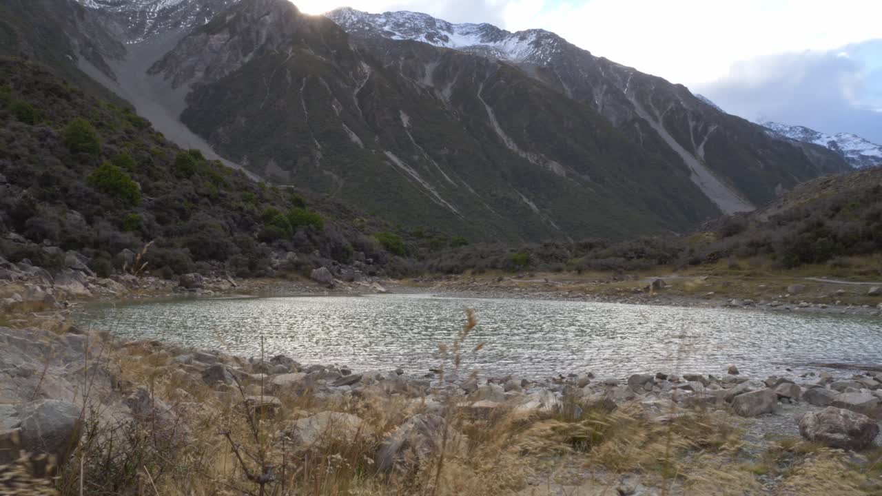 Small Lake And Mountains - Mount Cook In South Island, New Zealand - Wide Shot