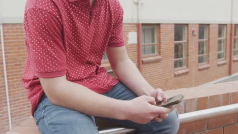 caucasian high school boy listening to music