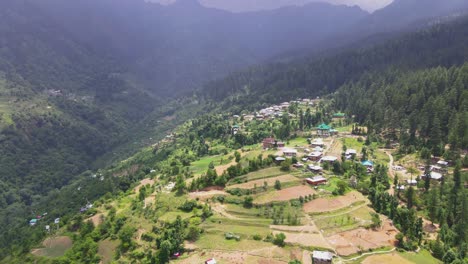 drone shot of a small village in sainj valley in himachal pradesh near manali, kasol