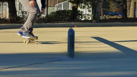 skater does a trick on a rail at the skate park