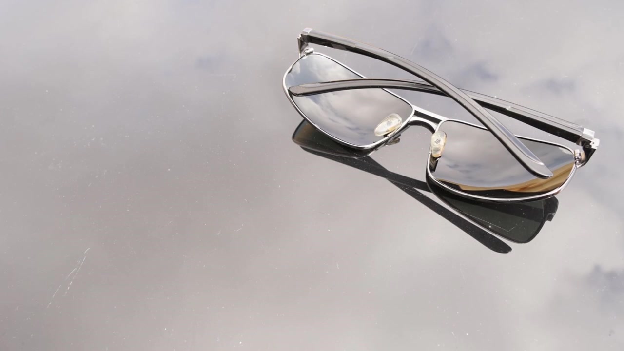 Time Lapse video about reflected clouds from table and sunglasses from Malta.