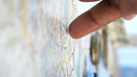person pointing at a map