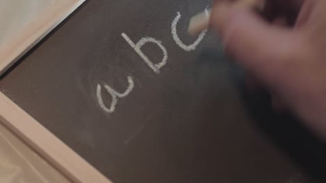 writing abc on a blackboard