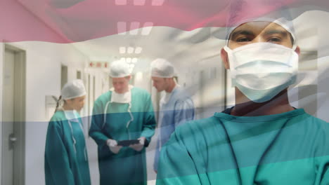 animation of flag of netherlands waving over surgeons in operating theatre