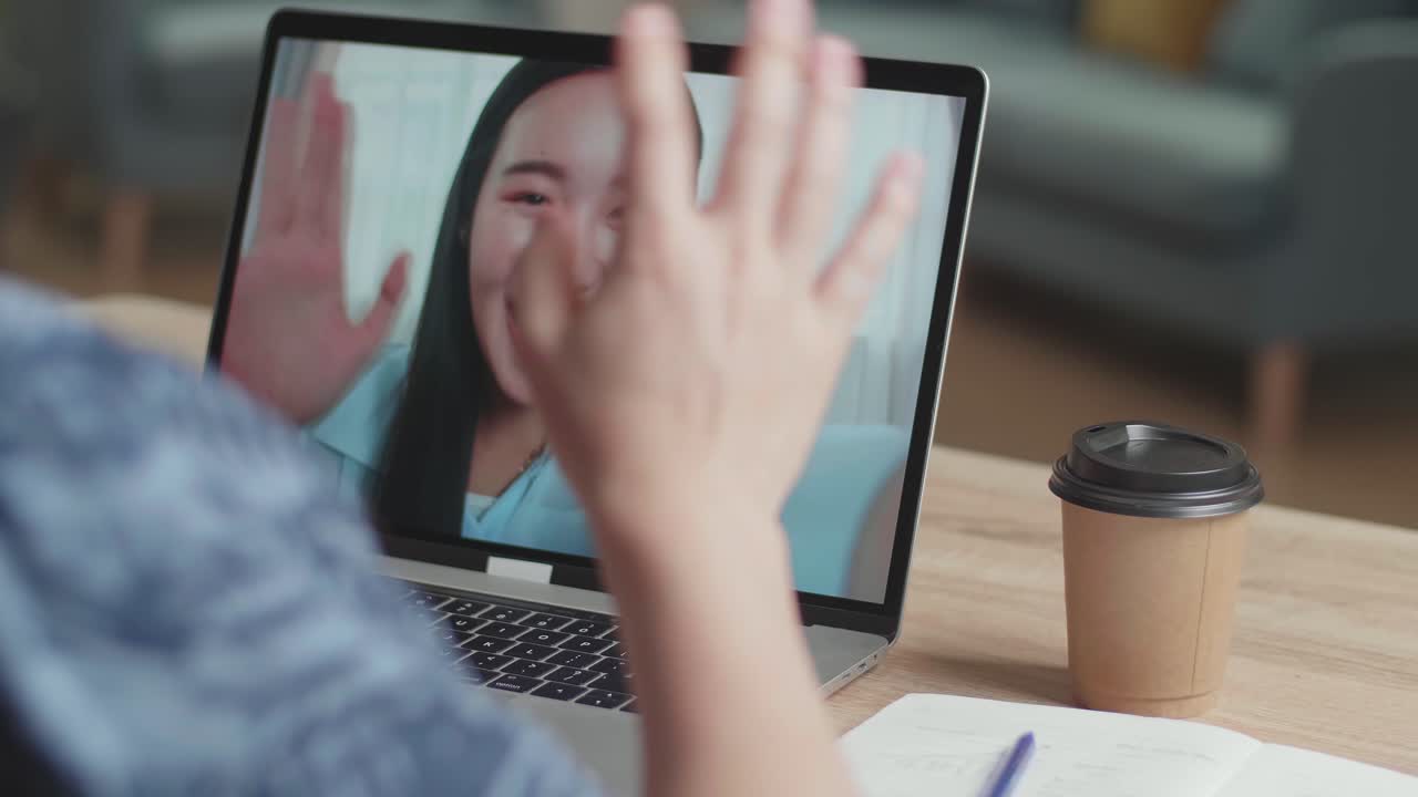 Close Up Man Waving Hand During Video Call With Woman On Laptop Computer , Video In 4K