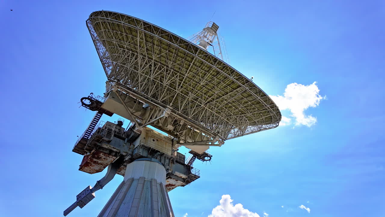 Large Satellite Dish Under a Blue Sky