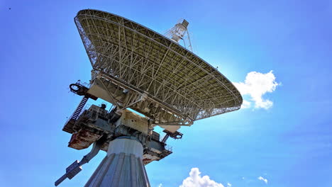 large satellite dish under a blue sky