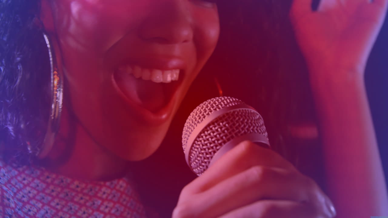Music industry singer performing on stage under red-purple lights, with animated sound wave overlay