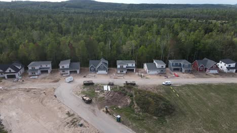 New-Settlement-is-being-built-rural-Cedar-Michigan,-Aerial-sideways-shot