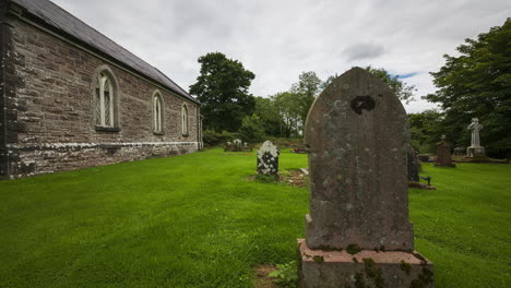 motion time lapse of local historical church of ireland graveyard in rural country of ireland during the day