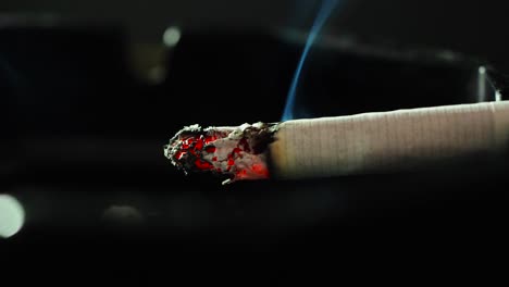 Close-up-smoking-cigarette-on-man-hand