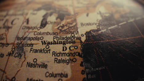 close-up of a vintage world globe showing the united states and washington d.c.
