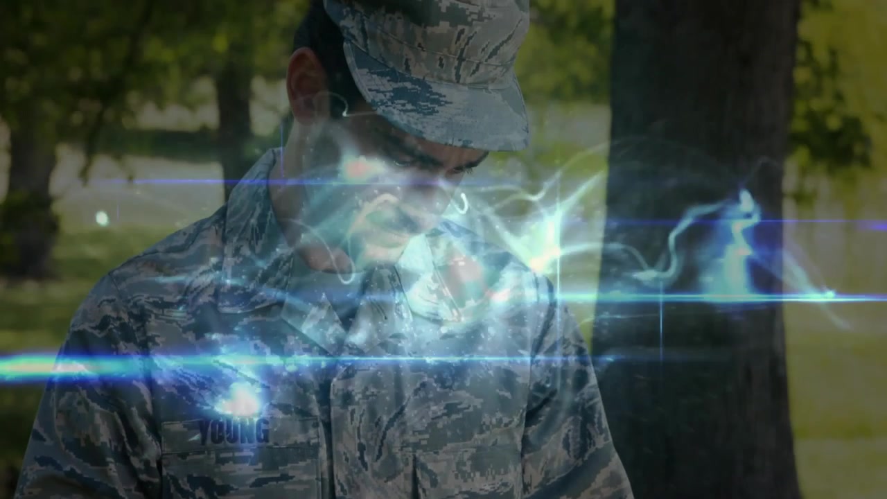 Service member tapping tablet interface in park, generating holographic military data for analysis
