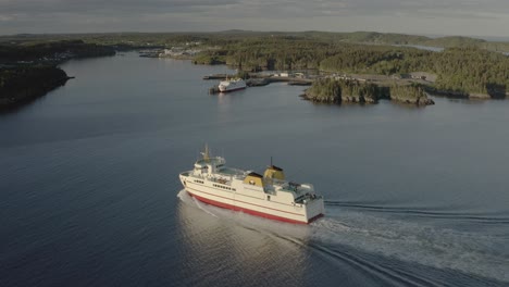 dolly left shot of ferry coming in to dock with terminal in background