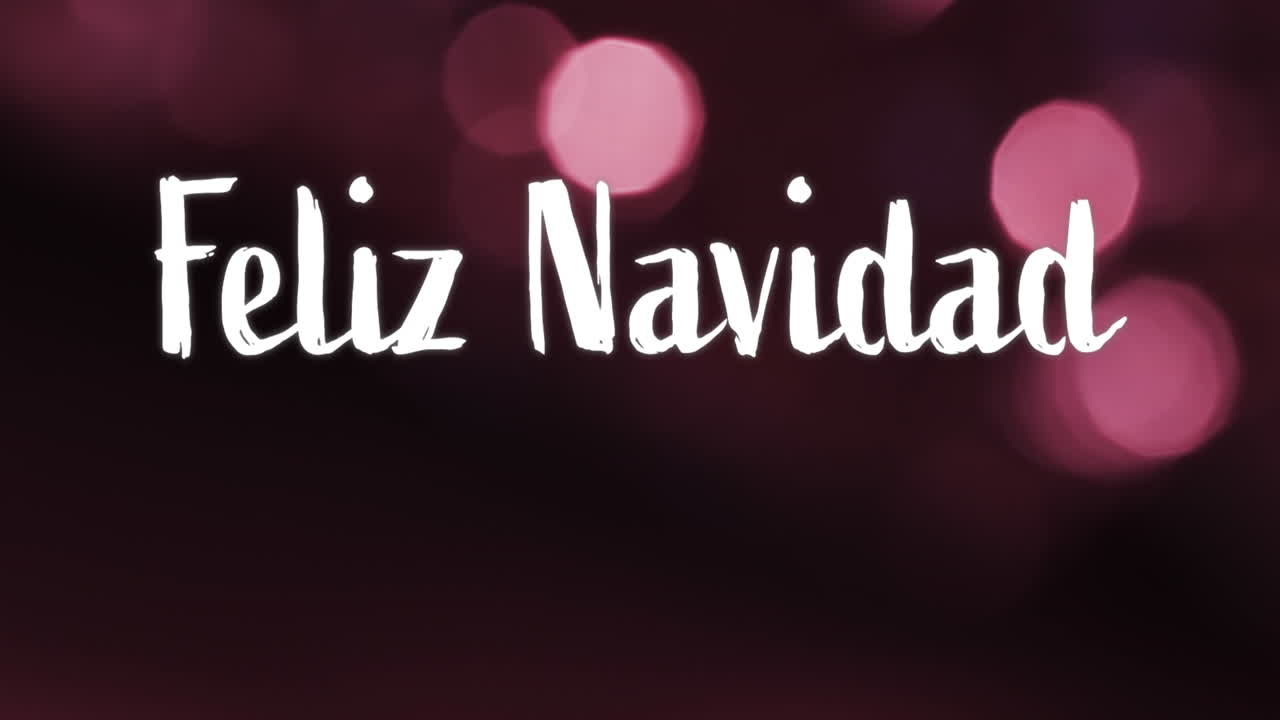animación del texto de feliz navidad sobre manchas rosadas de fondo claro