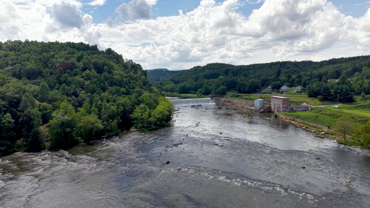 aerial rise up to reveal dam and old textile mill site in Fries Virginia