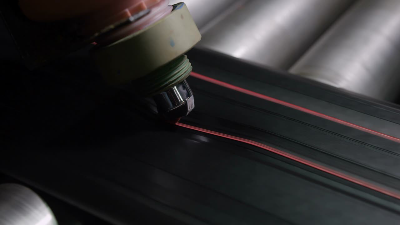 Machine Makes Red Marking on Tyre Rubber Macro